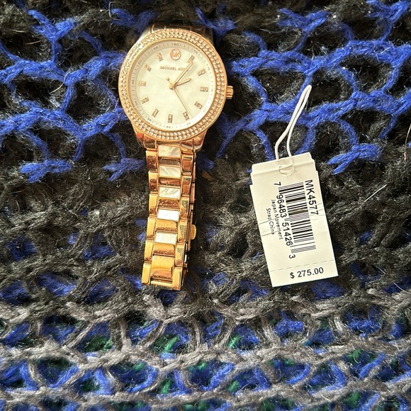 Michael Kors watch. Gold and mother of pearl color. Comes in original box. - Picture 2 of 4